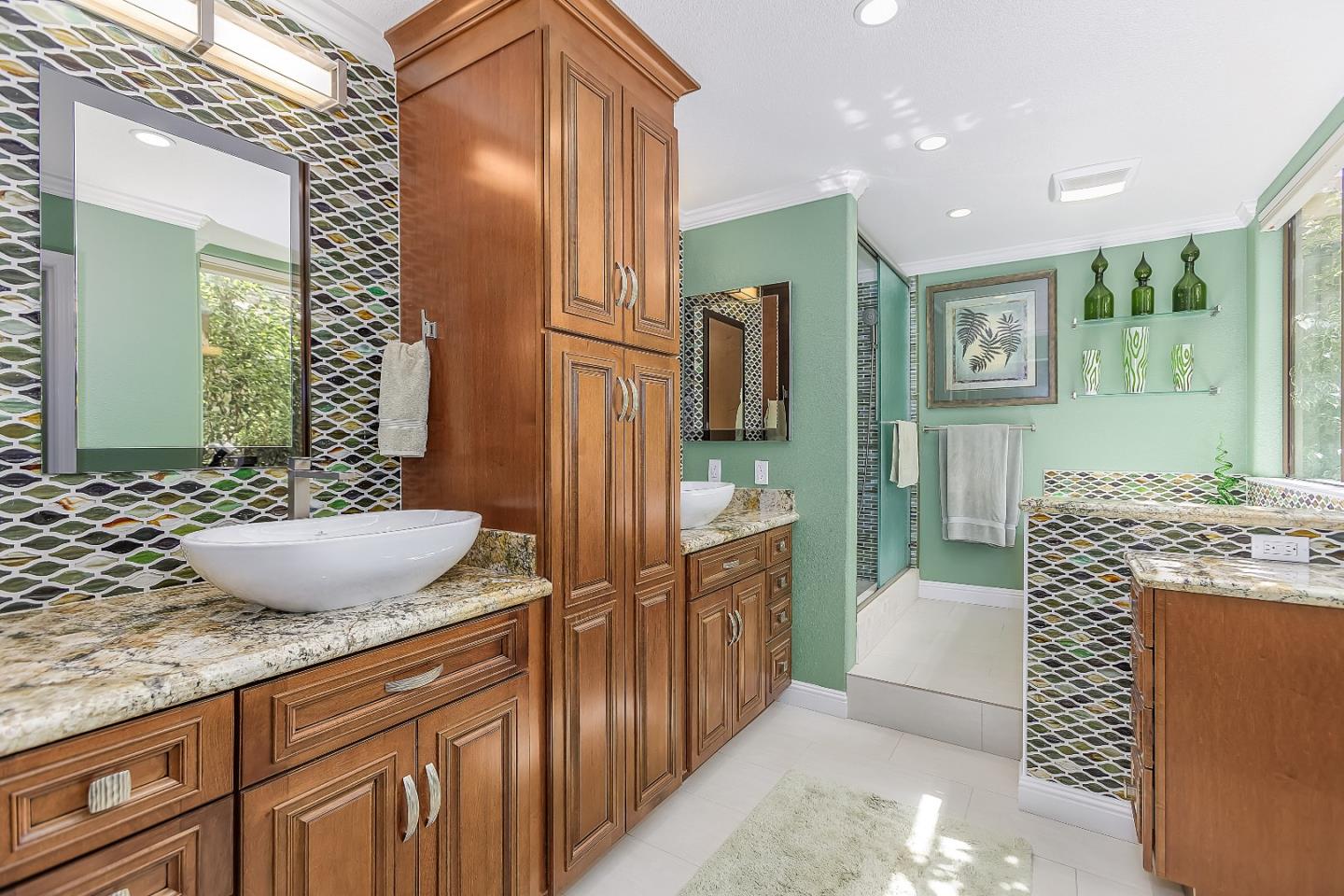 26 Deep Well Lane Los Altos, CA 94022 - Photo 20 of 39 a spacious bathroom with a granite countertop sink a mirror and shower