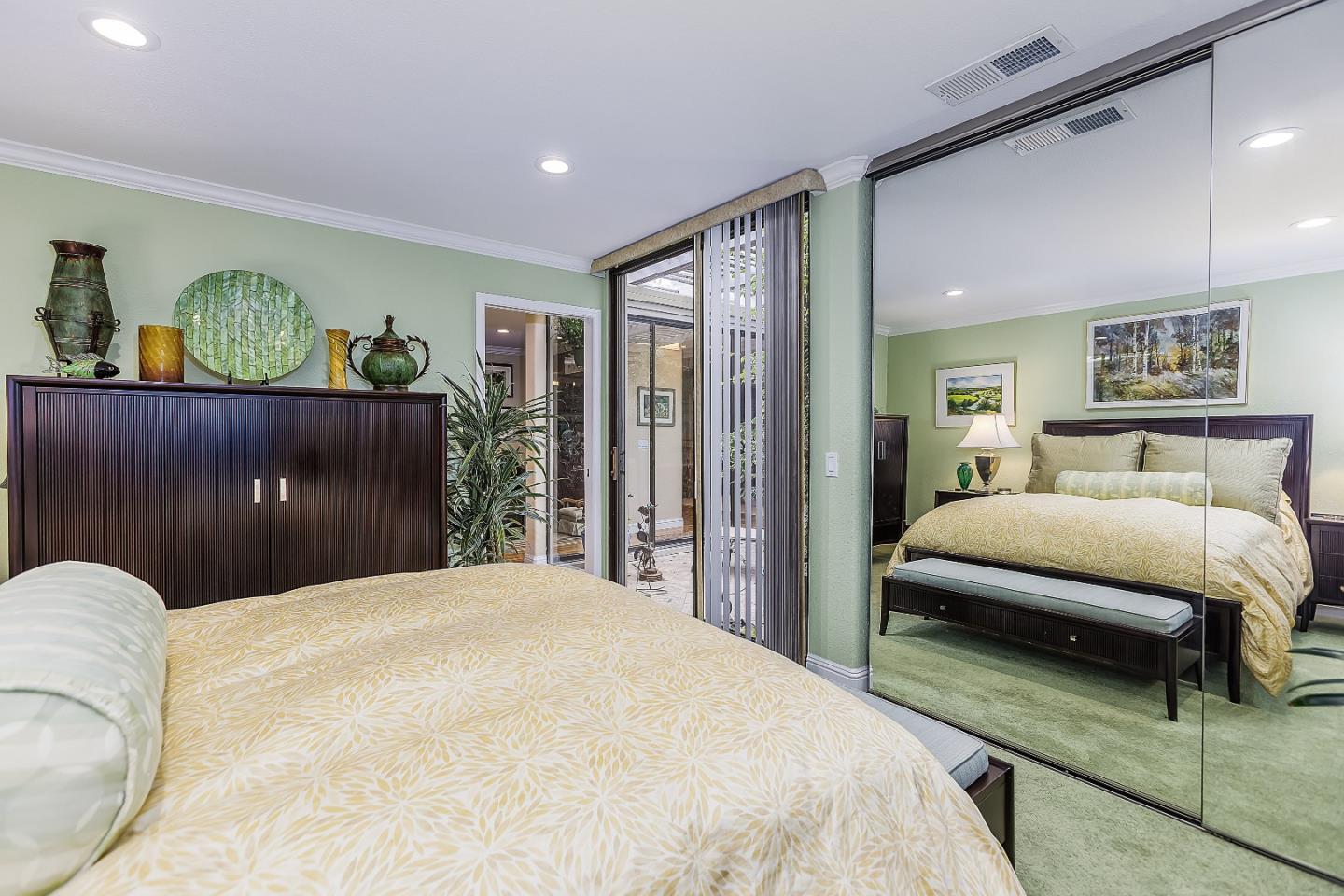 26 Deep Well Lane Los Altos, CA 94022 - Photo 26 of 39 a bedroom with a bed and a painting on the wall