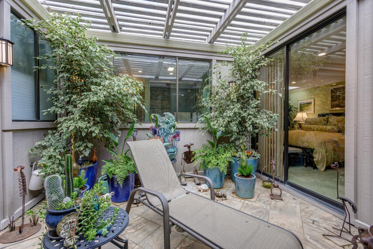 26 Deep Well Lane Los Altos, CA 94022 - Photo 29 of 39 a view of a house with backyard sitting area and garden