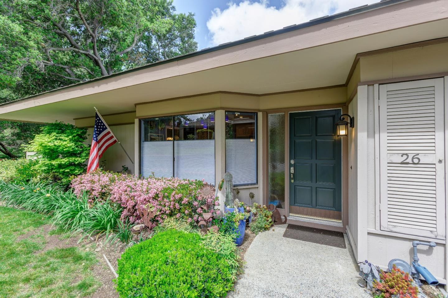 26 Deep Well Lane Los Altos, CA 94022 - Photo 3 of 39 a front view of a house with a yard