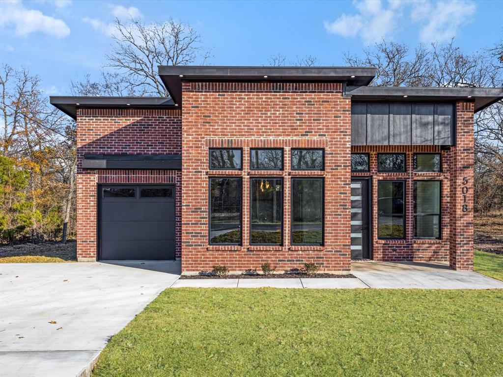 5018 Point La Vista Road Malakoff, TX 75148 - Photo 2 of 32 View of front of house featuring brick siding, concrete driveway, and a front yard