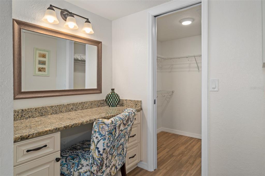 8211 Brent Street, Unit 847 Port Richey, FL 34668 - Photo 23 of 29 a bathroom with a granite countertop sink and a mirror