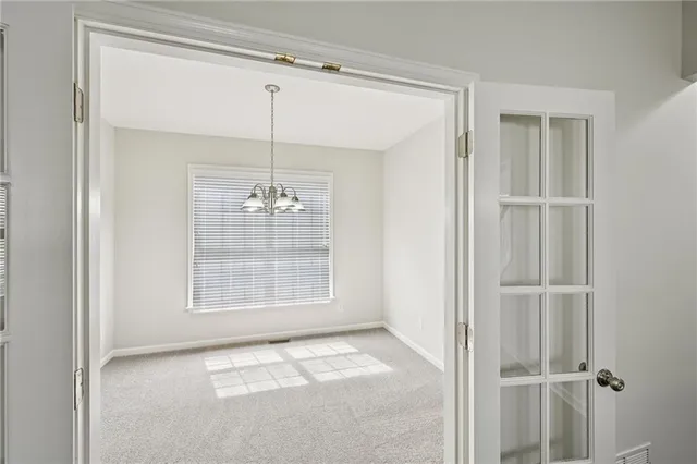 a kitchen with stainless steel appliances granite countertop a sink refrigerator and cabinets