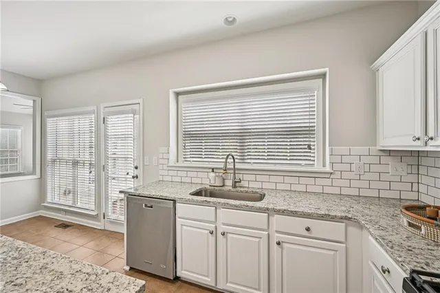 an empty room with furniture and a fireplace