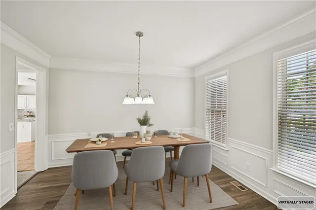 a view of a dining room with furniture window and wooden floor