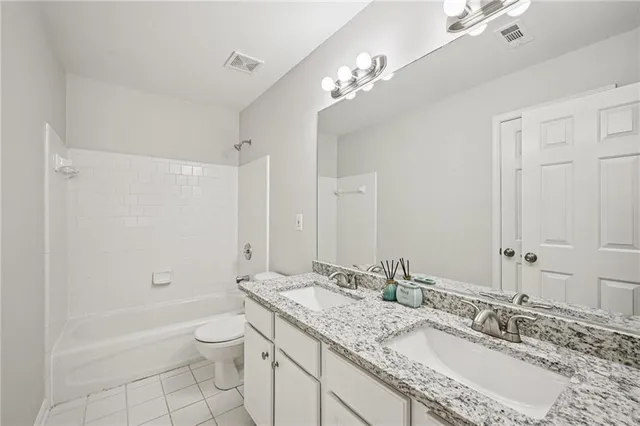 a living room with furniture and air hockey table