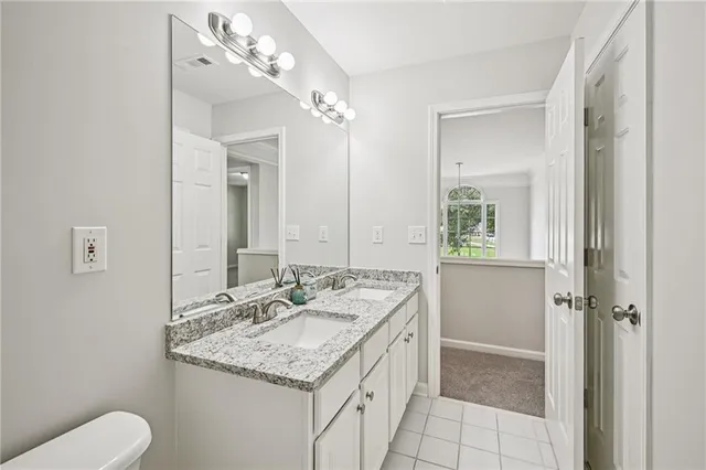 a room with pool table flat screen tv and windows