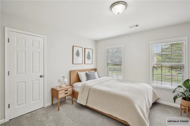 a room with pool table and windows