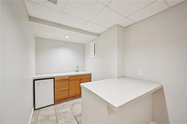 a view of a deck with wooden floor and wooden fence