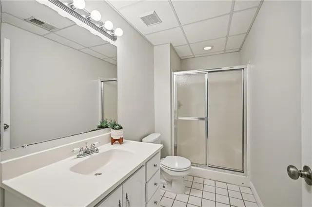 a picture of a bathroom with a refrigerator