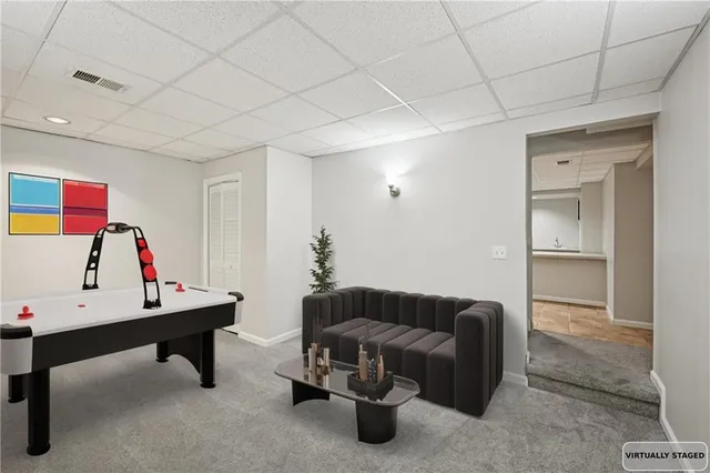 a view of a swimming pool with a table and chairs under an umbrella