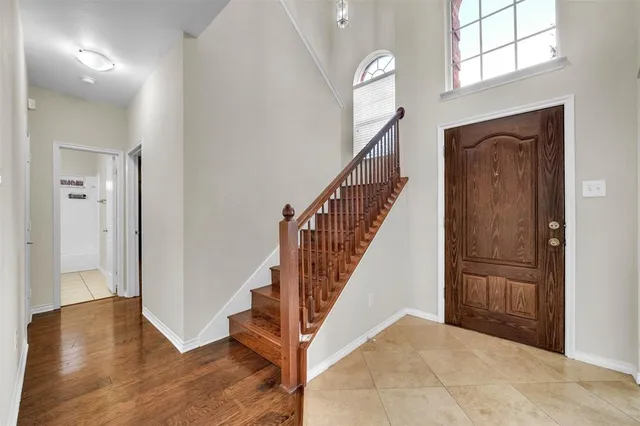 a view of entryway with wooden floor