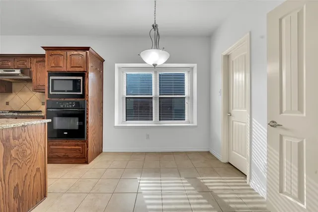 a view of kitchen and windows