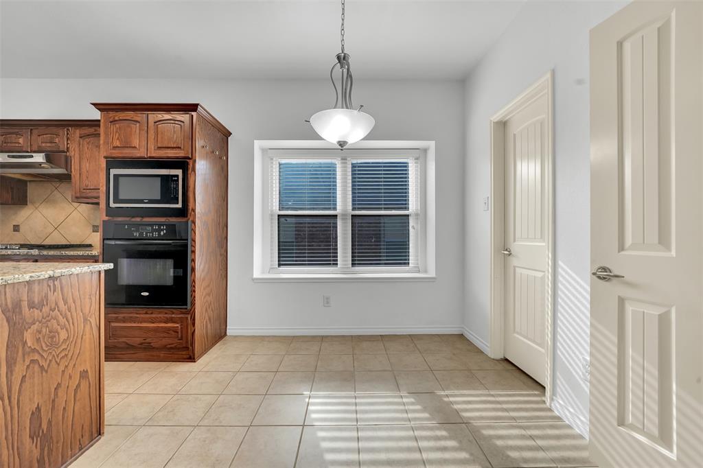 3305 Silver Springs Way Rowlett, TX 75089 - Photo 17 of 40 a view of kitchen and windows