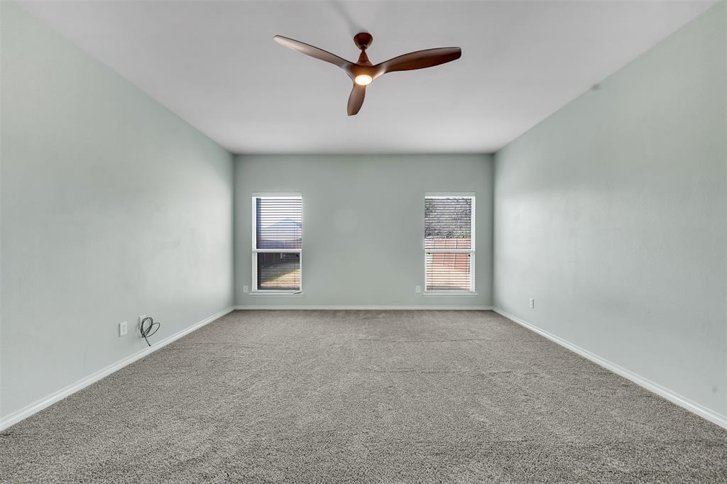 3305 Silver Springs Way Rowlett, TX 75089 - Photo 25 of 40 an empty room with fan and windows