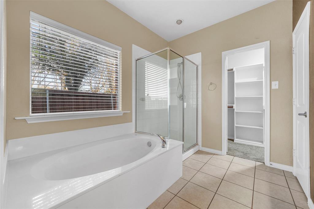 3305 Silver Springs Way Rowlett, TX 75089 - Photo 28 of 40 a spacious bathroom with a bathtub and a shower