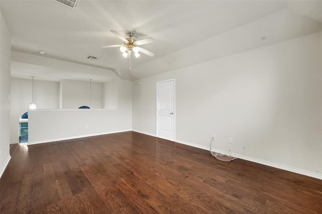 3305 Silver Springs Way Rowlett, TX 75089 - Photo 32 of 40 a view of an empty room with wooden floor