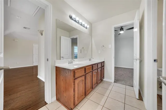 a bathroom with a sink a mirror and a shower