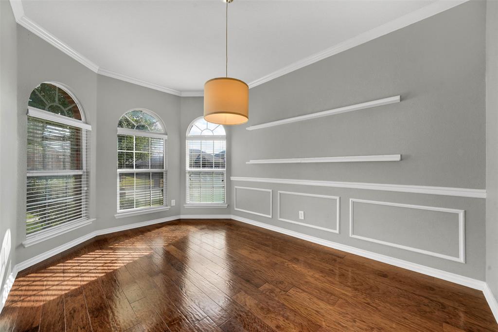 3305 Silver Springs Way Rowlett, TX 75089 - Photo 8 of 40 a view of an empty room with wooden floor and a window