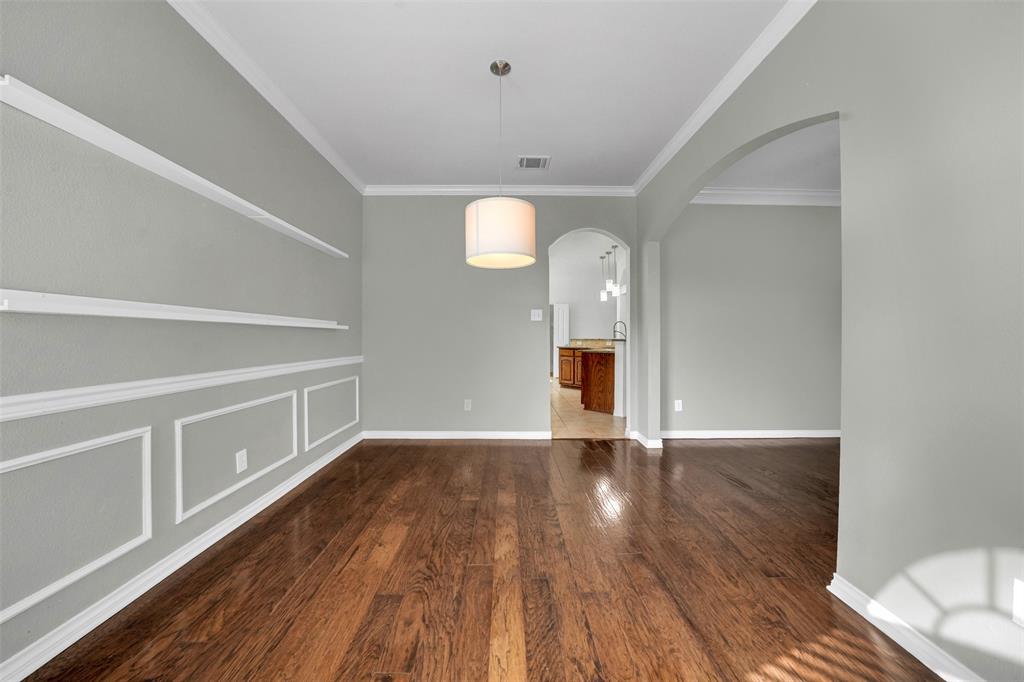 3305 Silver Springs Way Rowlett, TX 75089 - Photo 10 of 40 a view of an empty room with wooden floor and a window