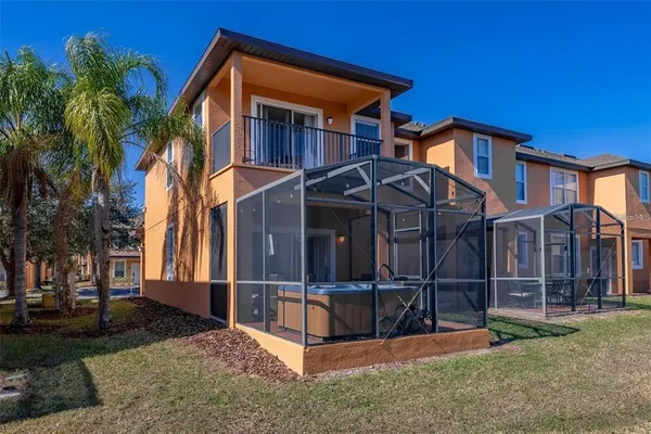 a view of a house with wooden fence