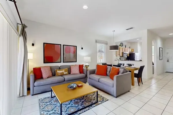 a living room with furniture and a rug