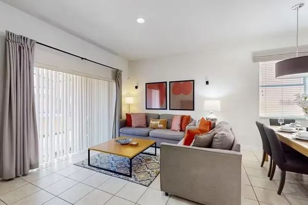 a living room with furniture and a window