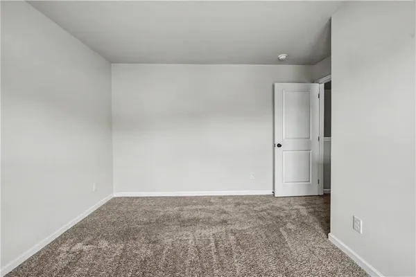 a spacious bathroom with a double vanity sink and a mirror