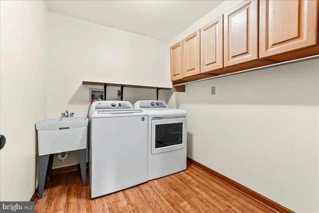a view of an entryway with wooden floor