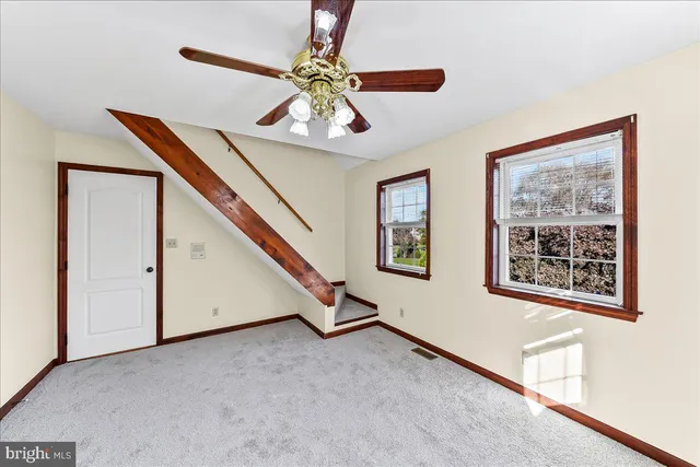 a view of a room with table tennis table and wooden floor