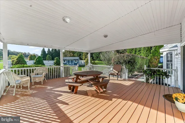 a view of a patio with a table chairs and a patio
