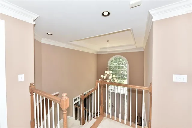 a view of a hallway with windows