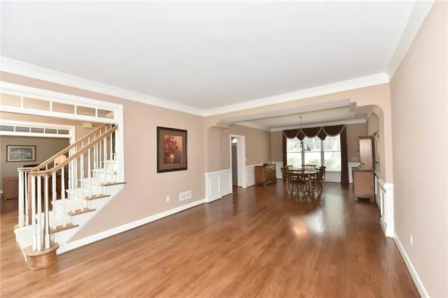 a view of dining room with furniture and wooden floor