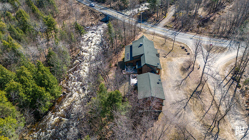 667 Days Mills Road St. Regis Falls, NY 12980 - Photo 3 of 51 HomeOnLakeOzoniaOutlet_A_Exterior_Side_T