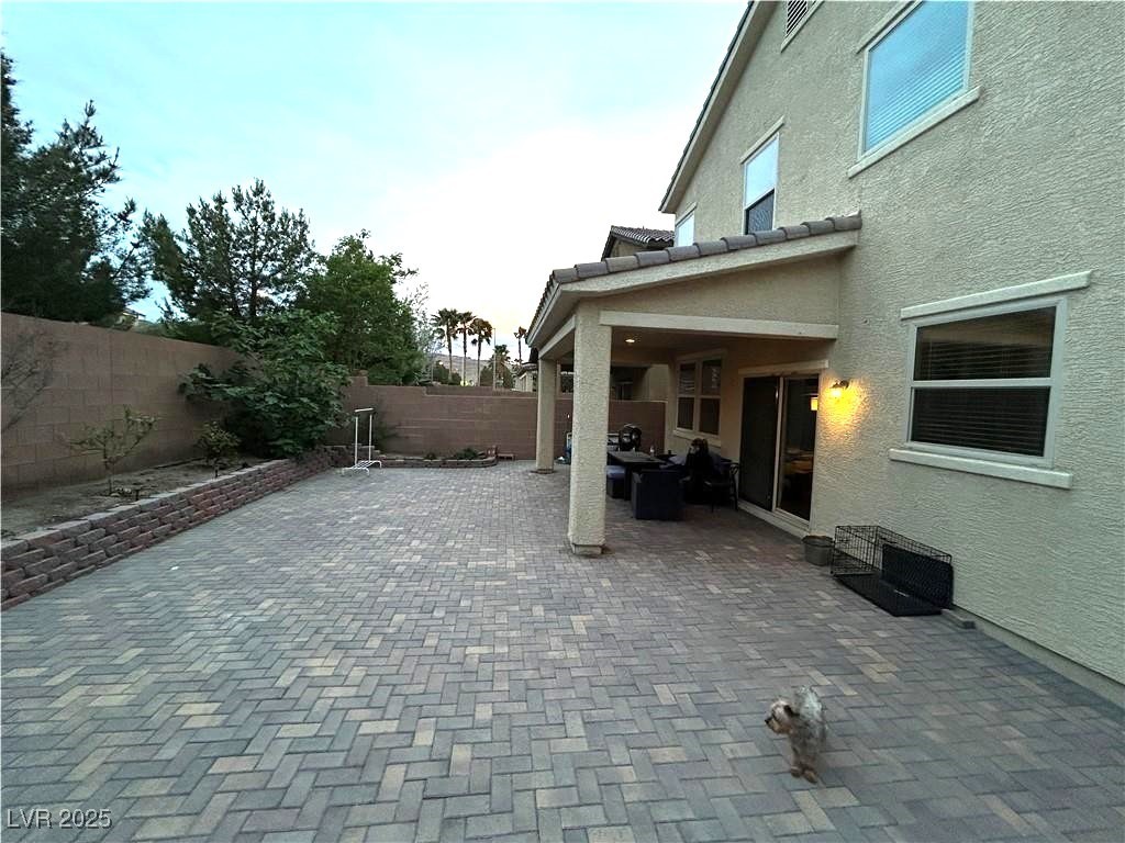 8977 Melridge Road Las Vegas, NV 89148 - Photo 7 of 35 View of patio featuring a fenced backyard