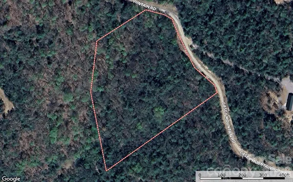 a view of a yard from a balcony