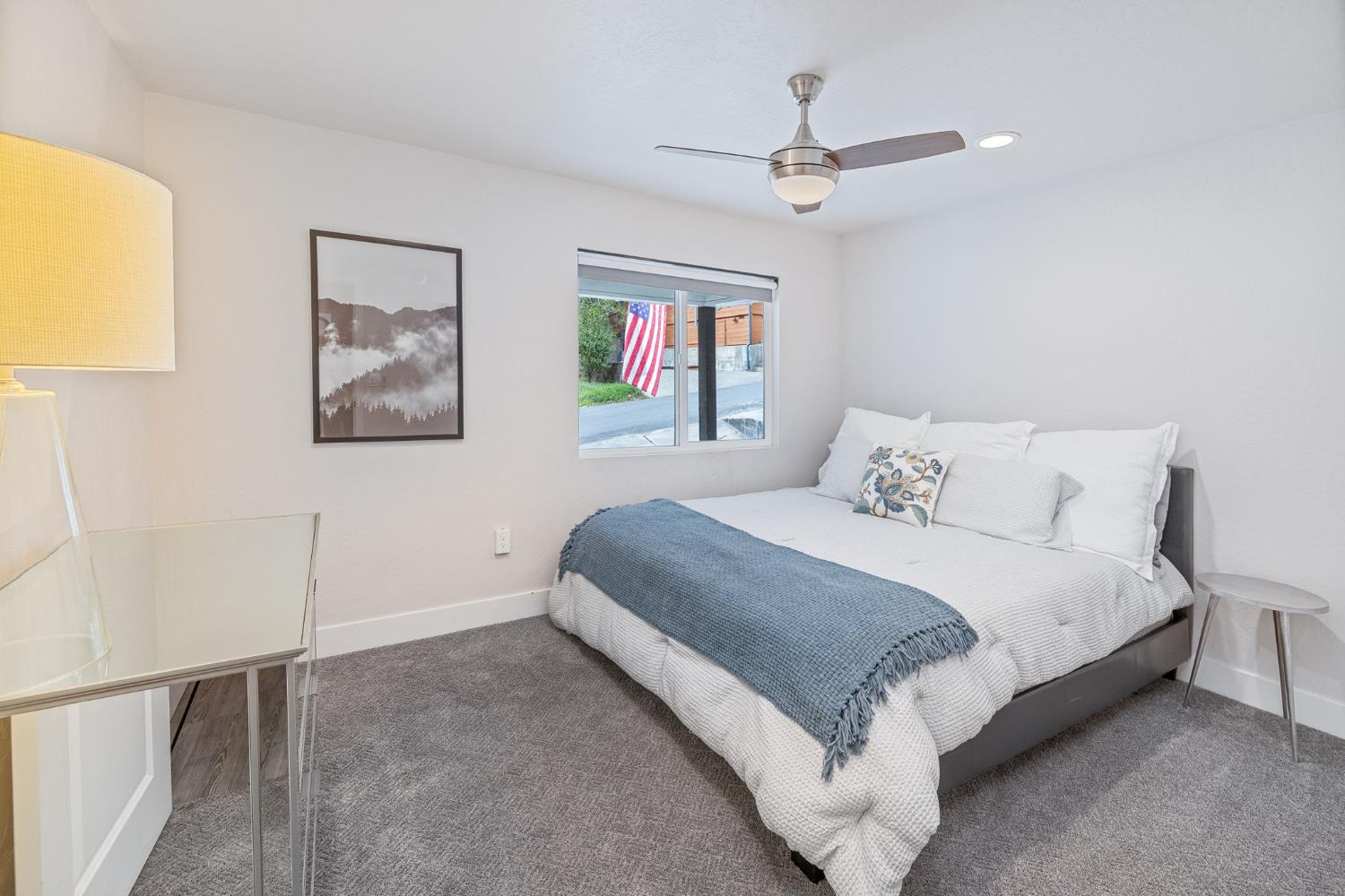 39253 Robin Bass Lake, CA 93604 - Photo 13 of 86 a bedroom with a large bed and a chandelier
