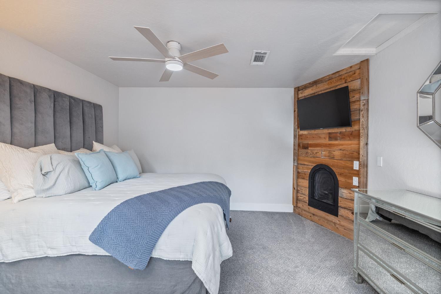 39253 Robin Bass Lake, CA 93604 - Photo 23 of 86 a bed room with a bed and a fireplace