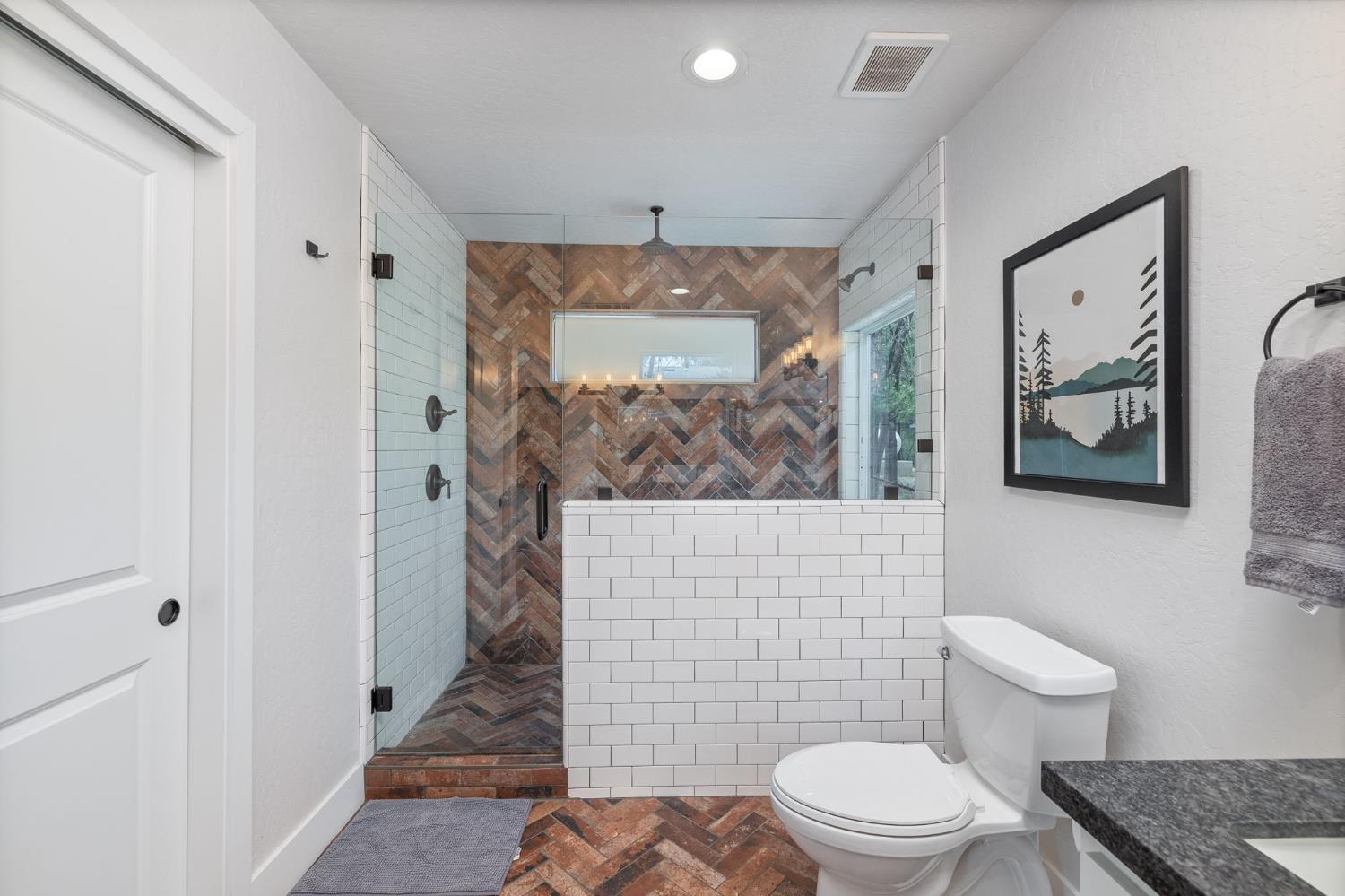 39253 Robin Bass Lake, CA 93604 - Photo 27 of 86 a bathroom with a toilet and a shower