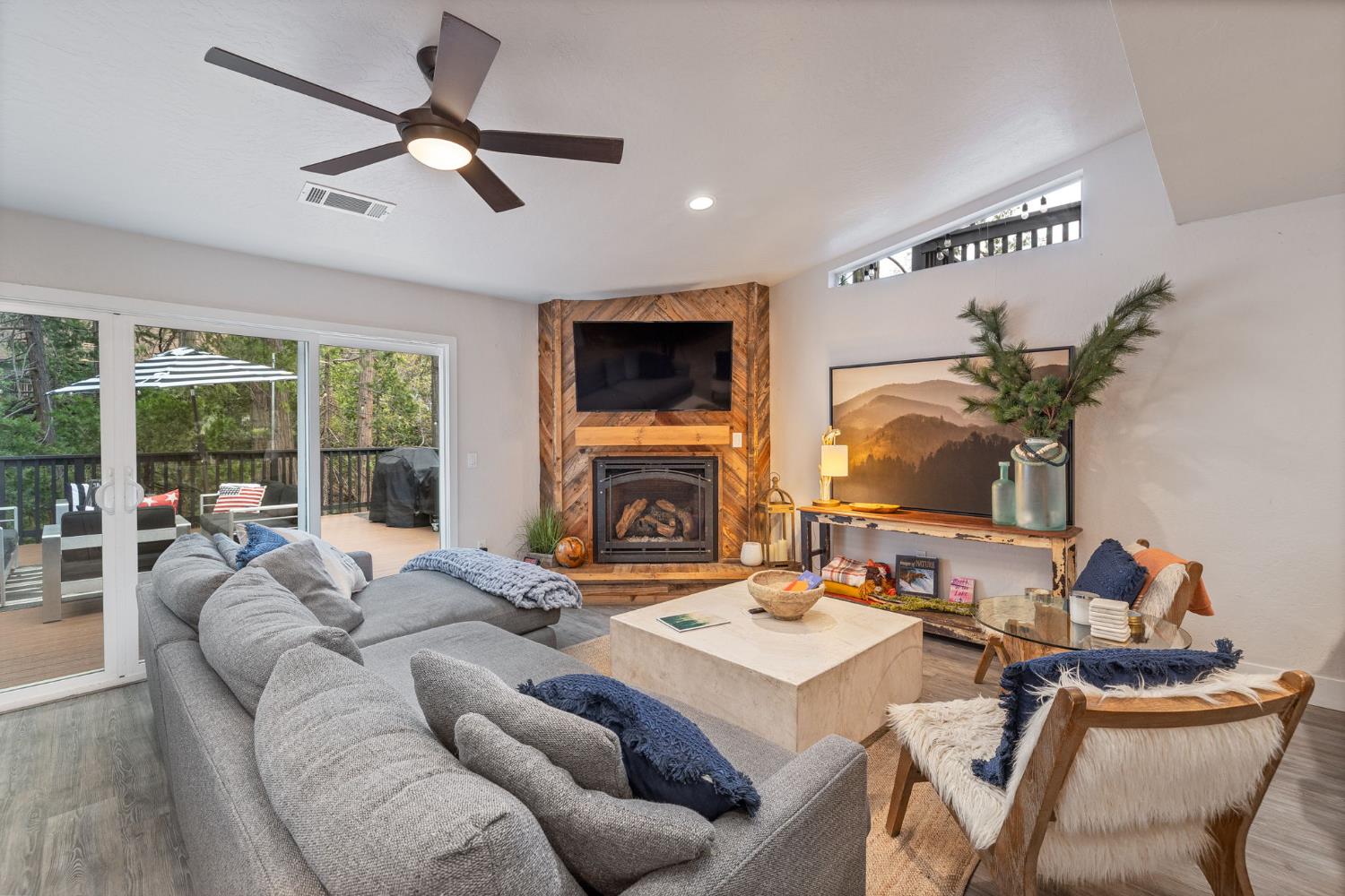 39253 Robin Bass Lake, CA 93604 - Photo 30 of 86 a living room with furniture a fireplace and a flat screen tv