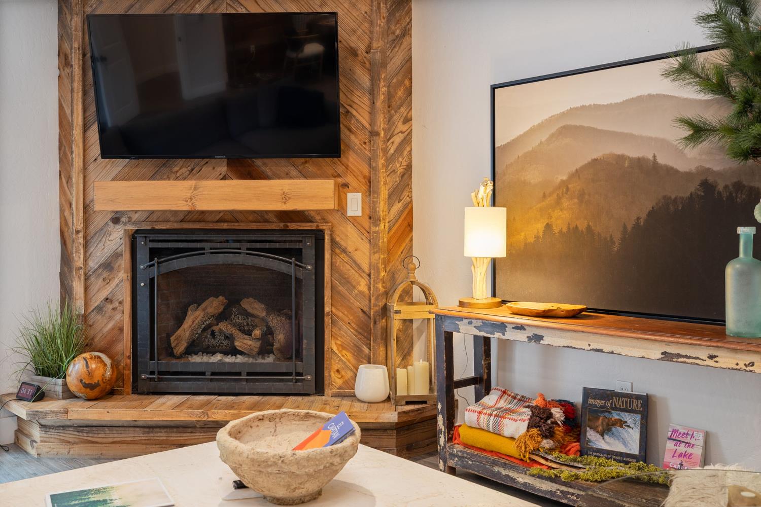 39253 Robin Bass Lake, CA 93604 - Photo 33 of 86 a living room with a fireplace and a flat screen tv