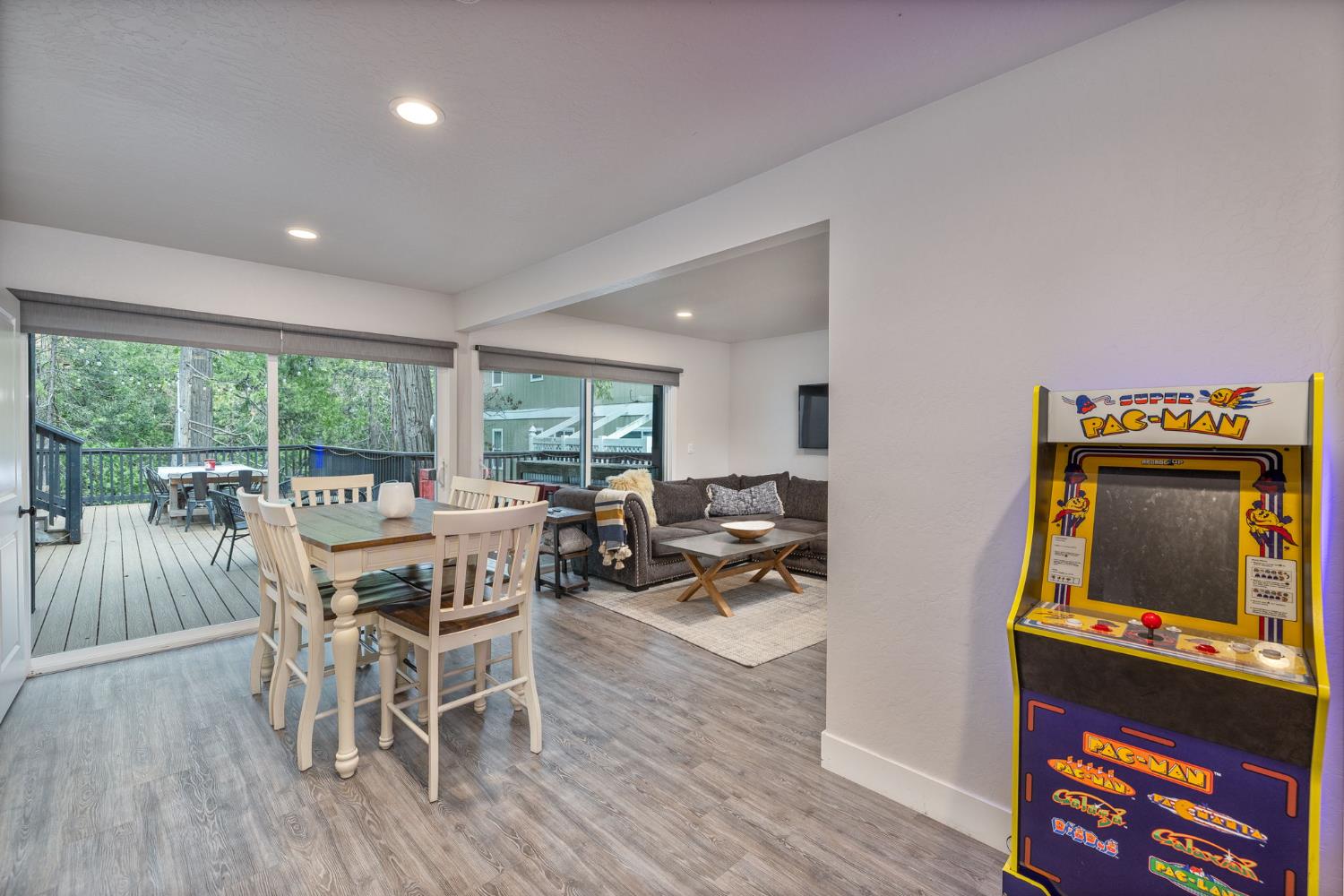 39253 Robin Bass Lake, CA 93604 - Photo 35 of 86 a dining room with furniture a rug a flat screen tv and a floor to ceiling window