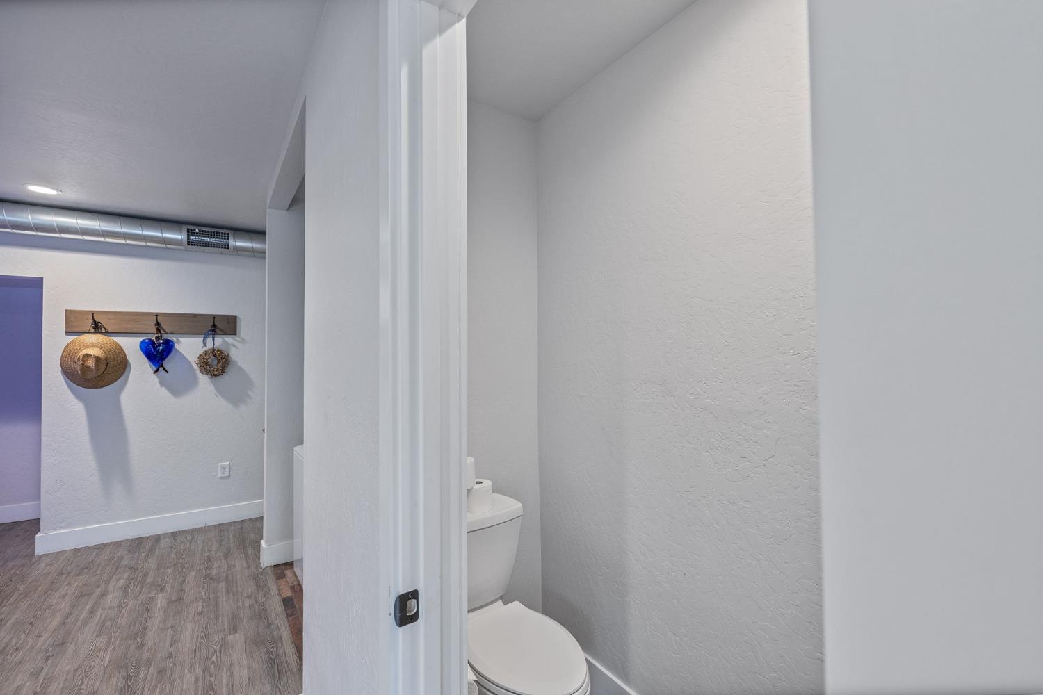 39253 Robin Bass Lake, CA 93604 - Photo 38 of 86 a bathroom with a toilet and a shower