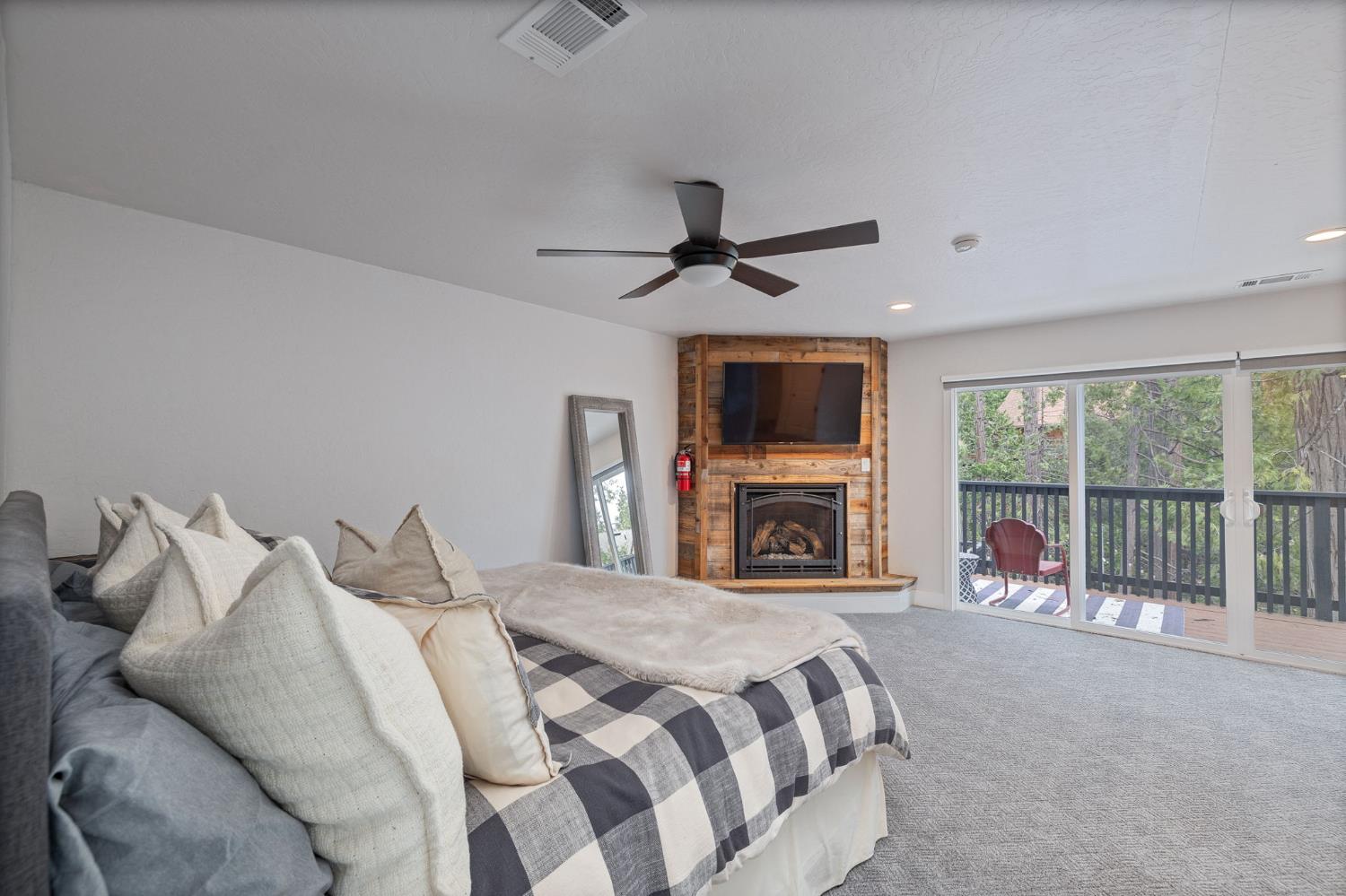39253 Robin Bass Lake, CA 93604 - Photo 42 of 86 a spacious bedroom with a large bed and a tv