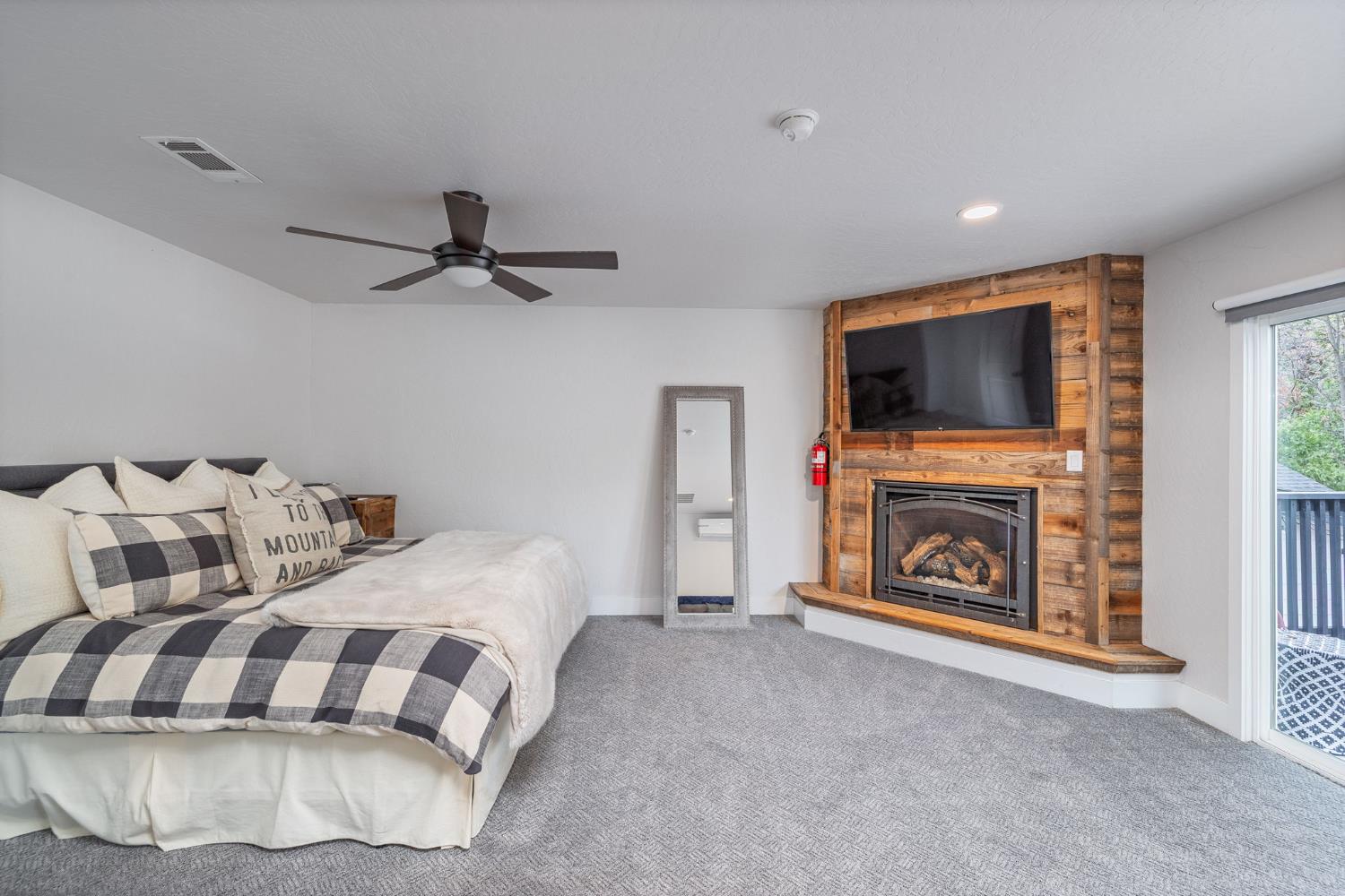 39253 Robin Bass Lake, CA 93604 - Photo 43 of 86 a bedroom with a bed and a flat screen tv