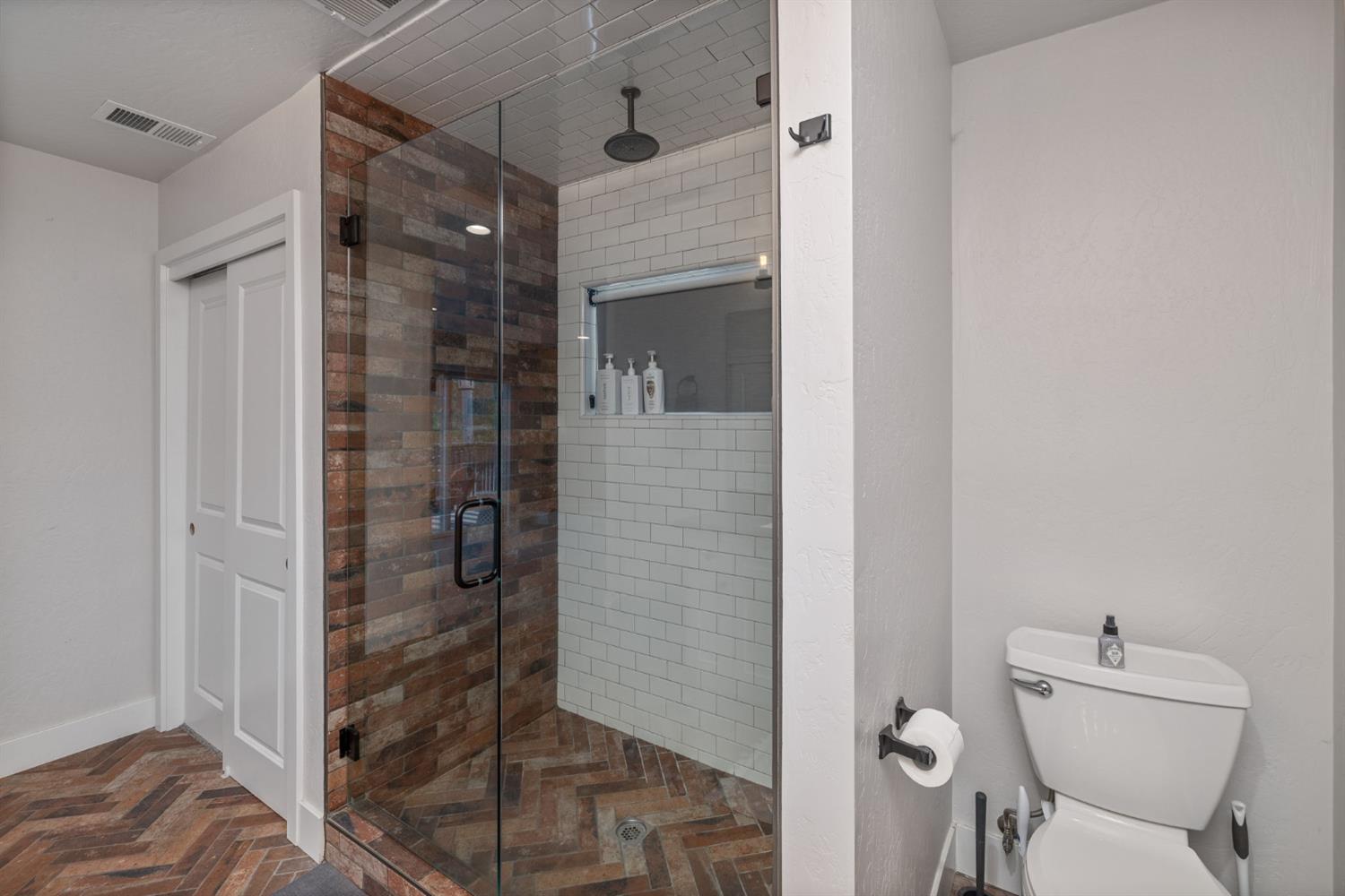 39253 Robin Bass Lake, CA 93604 - Photo 50 of 86 a bathroom with a toilet and a shower