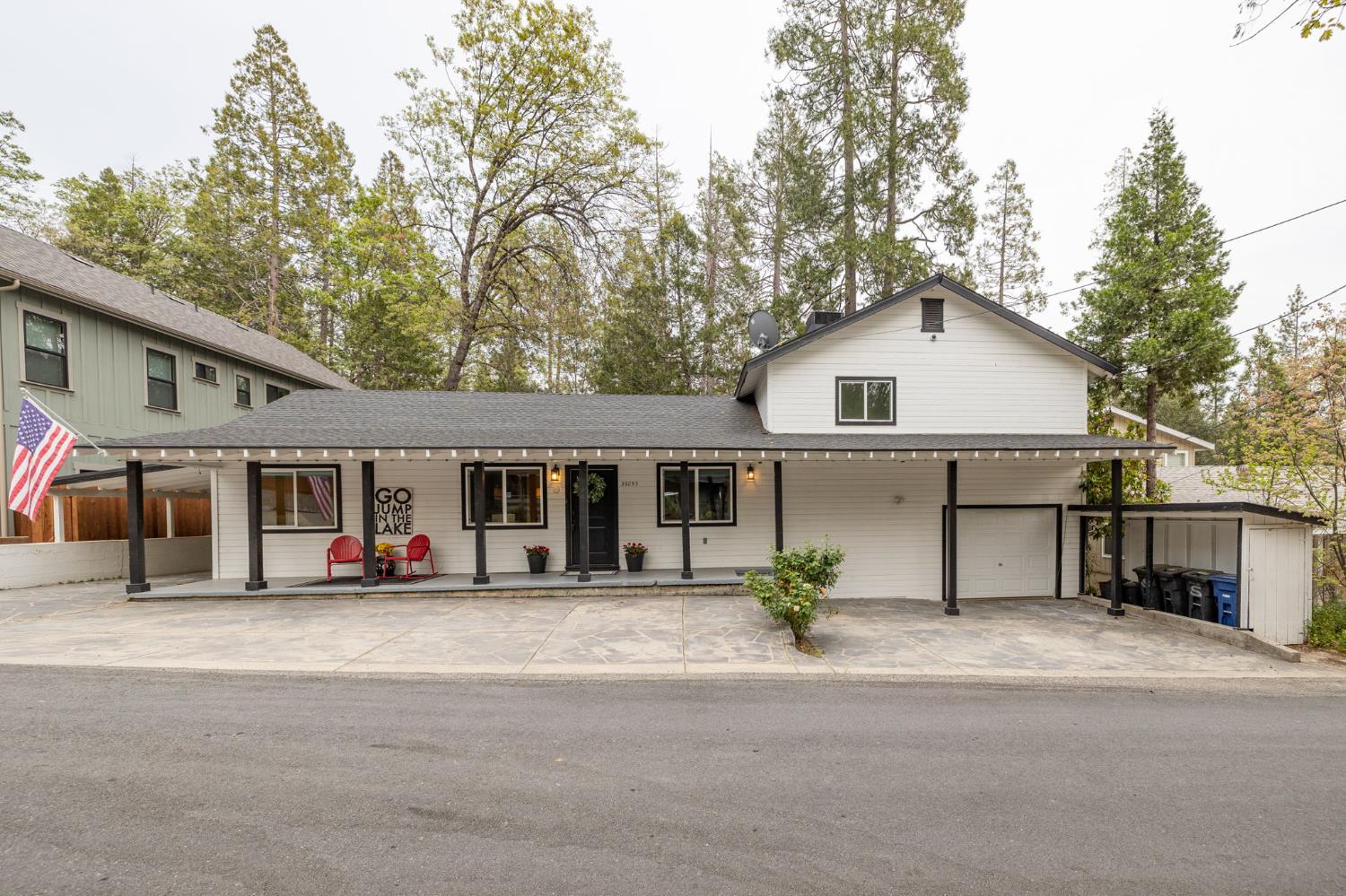 39253 Robin Bass Lake, CA 93604 - Photo 52 of 86 a front view of a house with a yard and trees