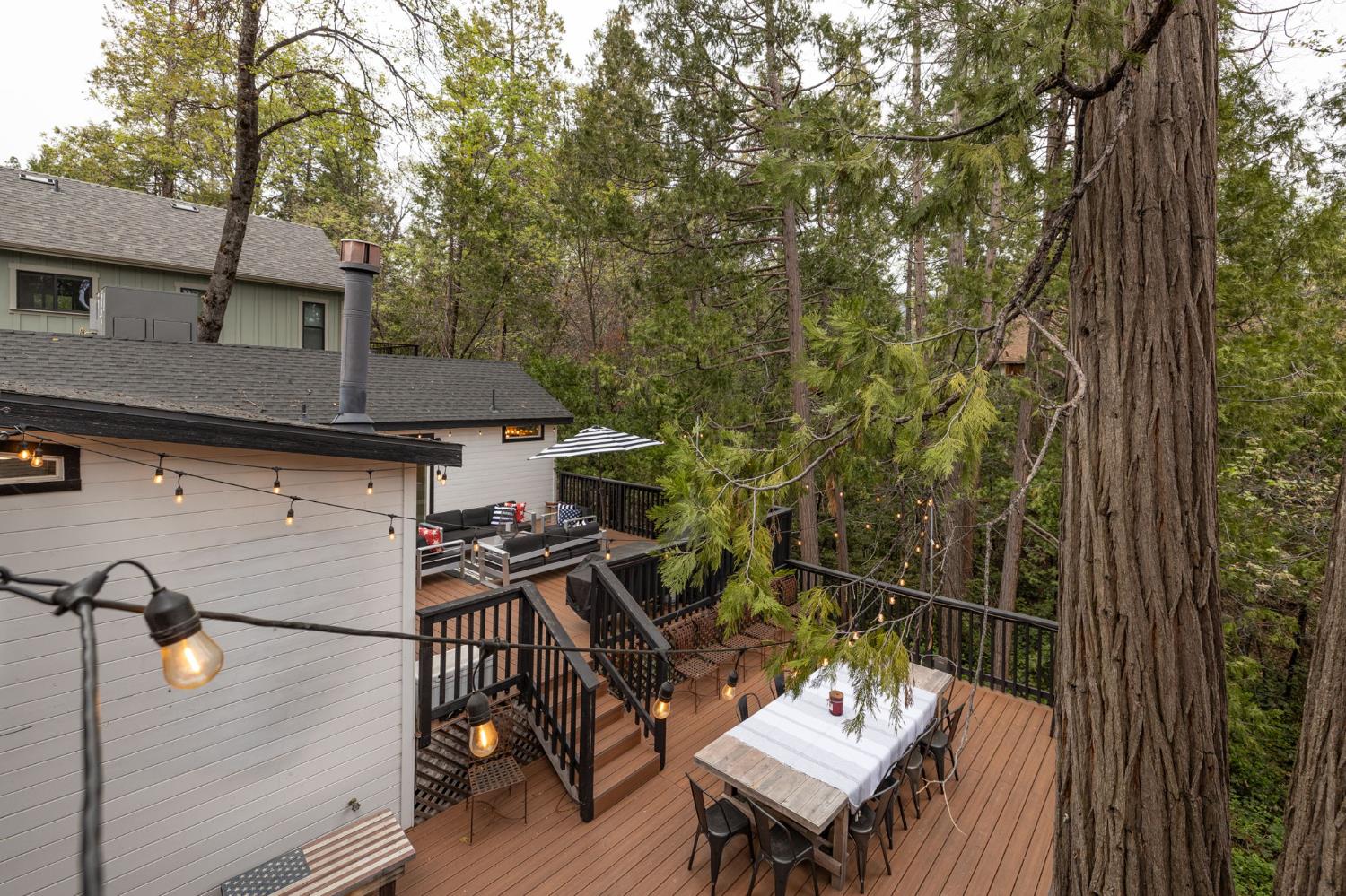 39253 Robin Bass Lake, CA 93604 - Photo 57 of 86 a view of a patio with table and chairs with wooden floor and fence