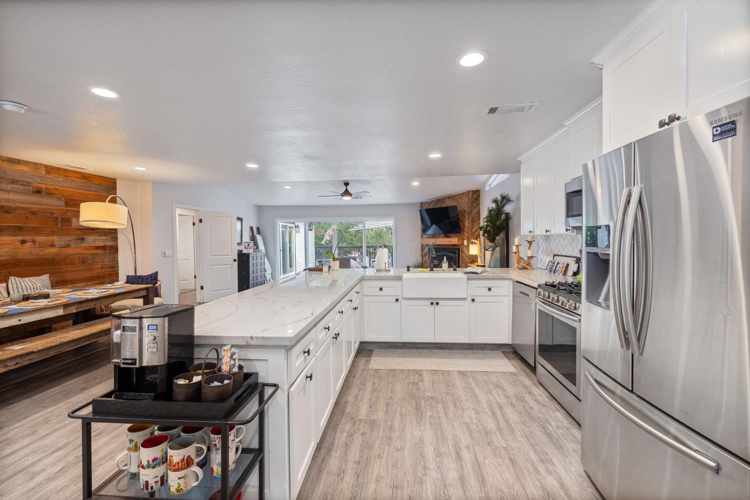 39253 Robin Bass Lake, CA 93604 - Photo 8 of 86 a large kitchen with stainless steel appliances lots of counter space and wooden floor