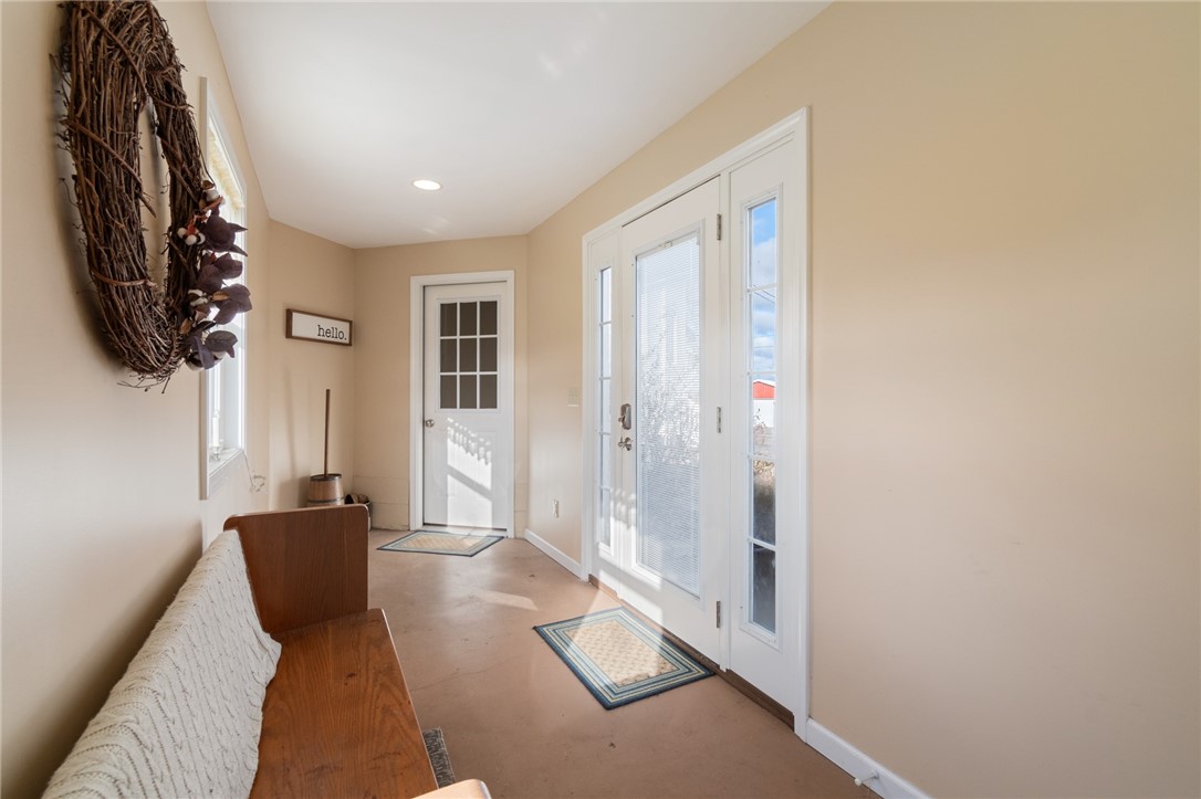4244 Pearsall Road Williamson, NY 14589 - Photo 14 of 45 The breezeway entrance - solid concrete floor!